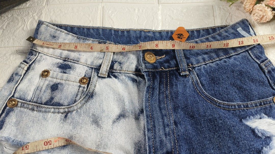 Versace Two Tone Distressed Denim Shorts Size M (Category: Shorts) located in Tagbilaran City. Submitted by grazie95 (Listing ID 1470014787, Image 3). Description: - Trendy two-tone design featuring split bleach and dark wash denim - High-waist fit with stylish gold-tone hardware and buttons - Edgy heavy distressing on both legs with raw frayed hems - Condition: EUC, ready to wear!.