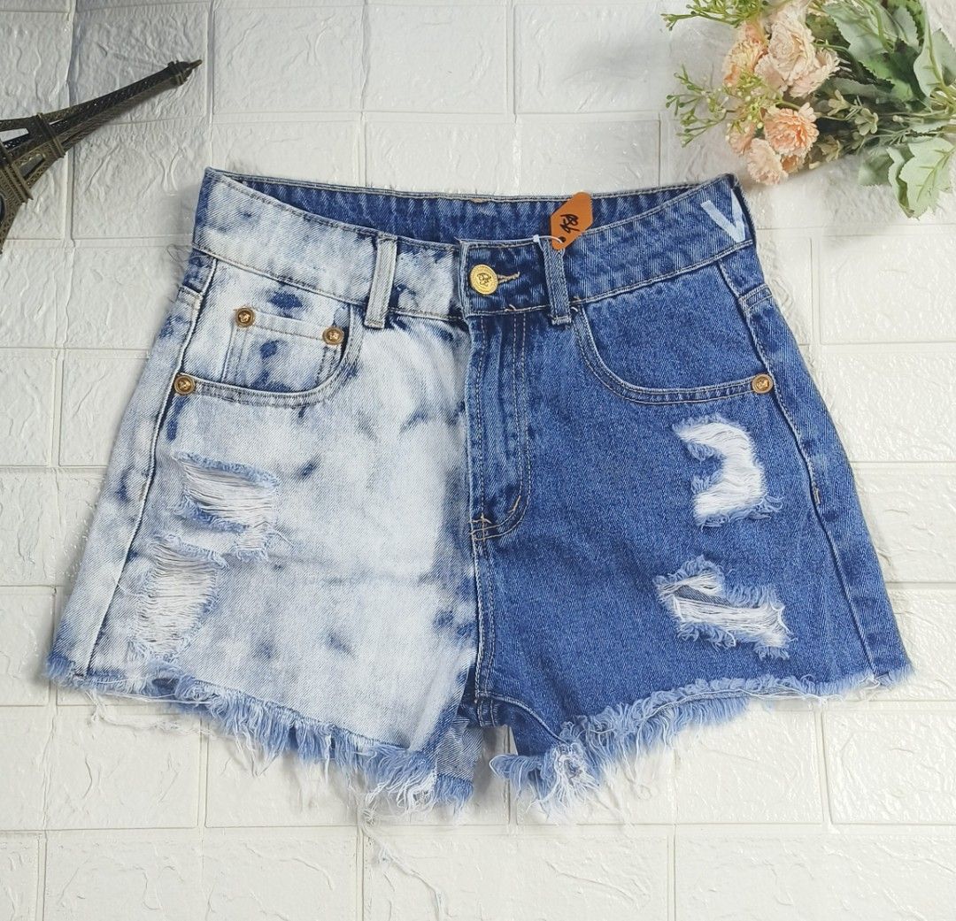 Versace Two Tone Distressed Denim Shorts Size M (Category: Shorts) located in Tagbilaran City. Submitted by grazie95 (Listing ID 1470014787, Image 1). Description: - Trendy two-tone design featuring split bleach and dark wash denim - High-waist fit with stylish gold-tone hardware and buttons - Edgy heavy distressing on both legs with raw frayed hems - Condition: EUC, ready to wear!.