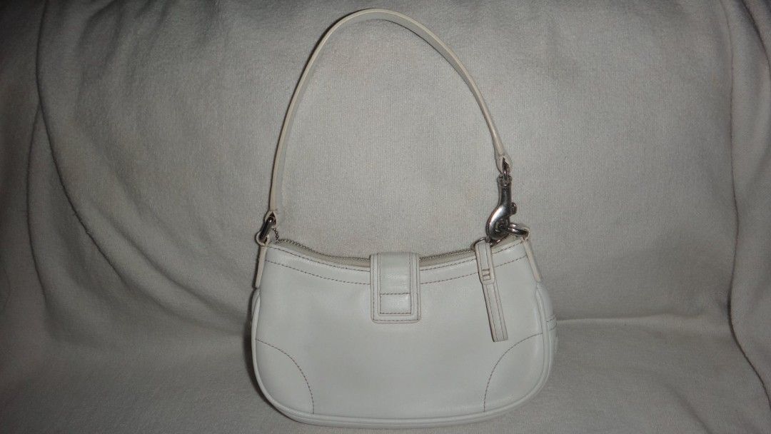 Coach Hamptons Leather Buckle || READ DESCRIPTION FIRST (Category: Shoulder Bags) located in Quezon City. Submitted by hyacinthflower (Listing ID 1470078795, Image 2). Description: VERY RARE! -Small coach bag -Flaws are barely noticeable (just check the photos but the colors may vary) -Needs cleaning (mas maganda tingnan yung bag in person) -perfect for people who dont carry lots of items in their bags -NO LAST PRICE -Can do Down Payments -No Rus