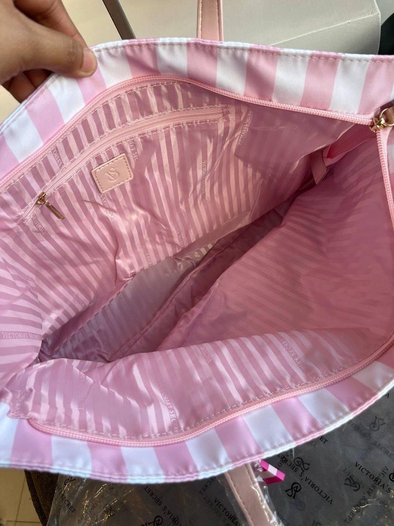 Victoria Secret Tote Bag (Category: Tote Bags) located in Manila. Submitted by r2luxe (Listing ID 1470060991, Image 3). Description: 🎀 VICTORIA’S SECRET HERITAGE STRIPE LARGE TOTE 🎀 Pink, pretty, and effortlessly chic! 💗🤍 The perfect tote for your everyday essentials, featuring the iconic pink-and-white Heritage Stripe pattern, long shoulder straps, and elegant gold-tone monogram hardware. ✨ Perfect for shopping, work, travel, or your everyda