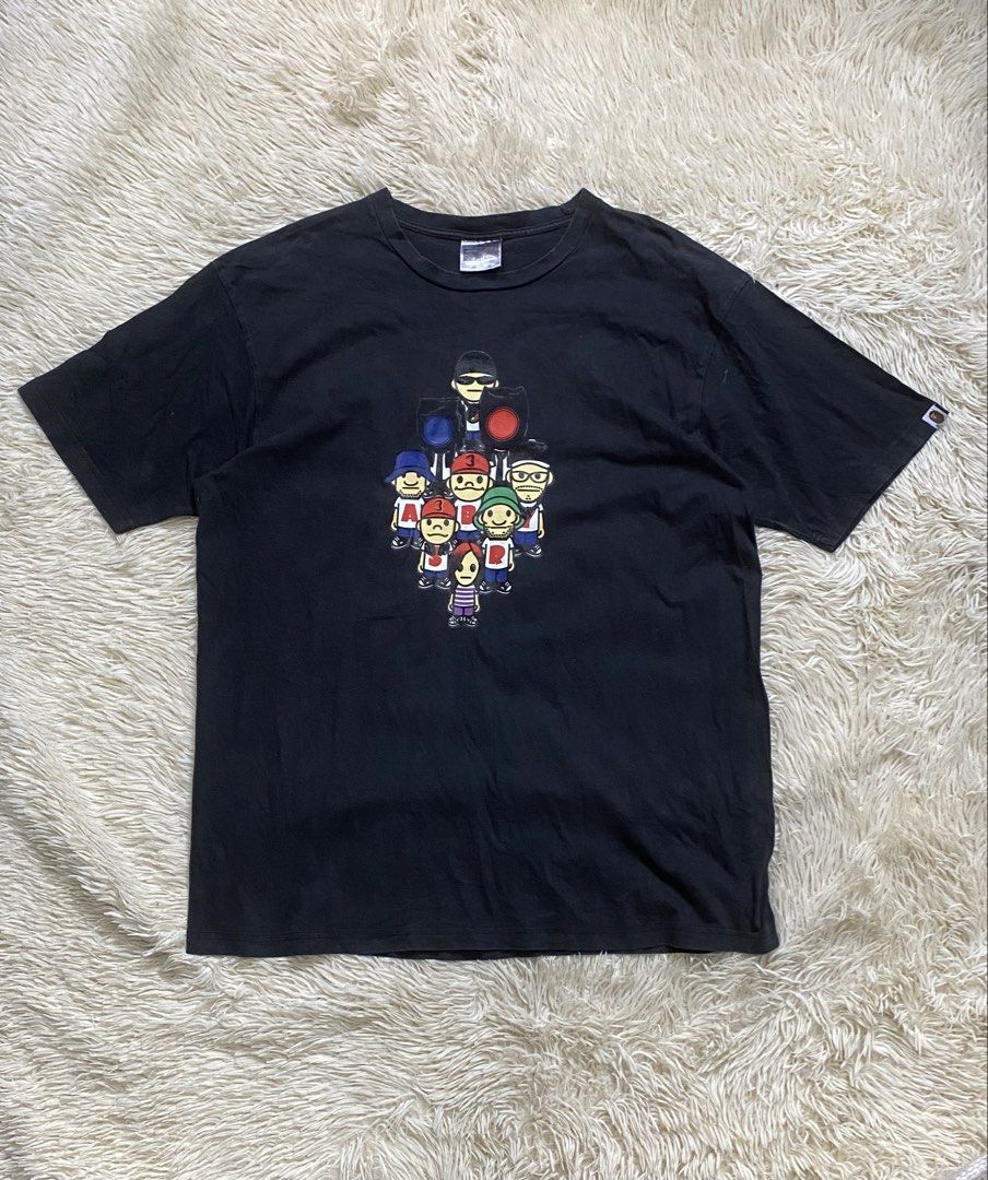 Vintage bape head 2003 tee (Category: Tshirts & Polo Shirts ) located in Manila. Submitted by switchcity (Listing ID 1470076093, Image 1). Description: - Brand: A Bathing Ape (BAPE) - Color: Black - Material: 100% Cotton - Fit: Regular fit, short sleeves - Design: Classic character graphic on chest - Details: Small woven ape tag on left sleeve, branded neck label - Condition: Minor fading from regular washing.