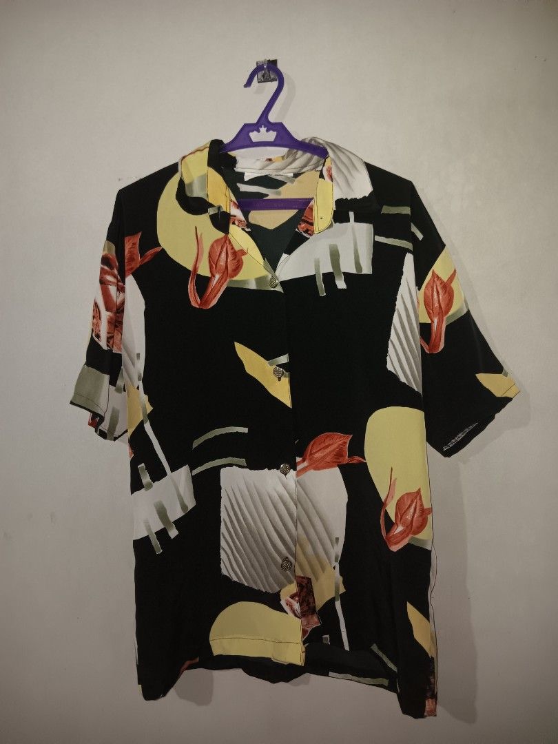 Vintage Black Abstract Pattern Short Sleeve Shirt (Category: Blouses) located in Manila. Submitted by gelo.is_selling (Listing ID 1470123382, Image 1). Description: - Style: Short-sleeve button-up with collar - Design: Bold abstract geometric and floral print in yellow, white, and rust orange - Fit: Relaxed fit - Fabric: Lightweight and breathable - Occasion: Ideal for summer and casual outings - Condition: Brand new / Excellent Measurement for r