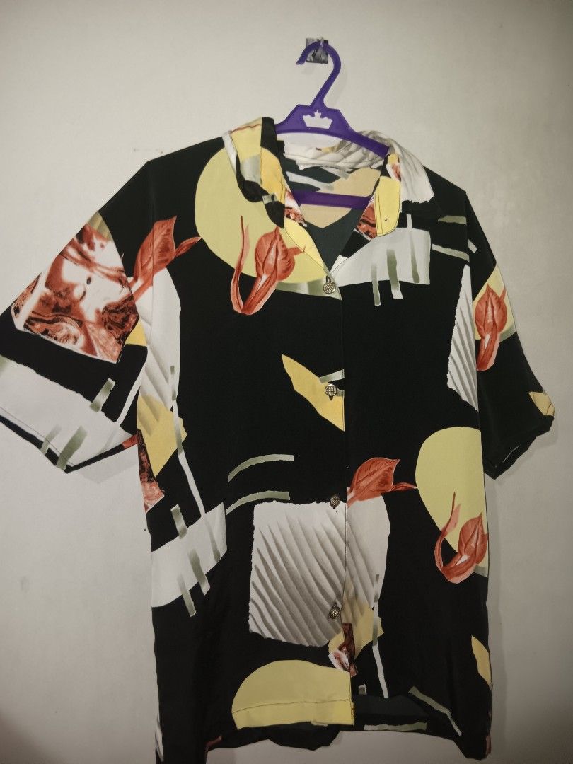 Vintage Black Abstract Pattern Short Sleeve Shirt (Category: Blouses) located in Manila. Submitted by gelo.is_selling (Listing ID 1470123382, Image 3). Description: - Style: Short-sleeve button-up with collar - Design: Bold abstract geometric and floral print in yellow, white, and rust orange - Fit: Relaxed fit - Fabric: Lightweight and breathable - Occasion: Ideal for summer and casual outings - Condition: Brand new / Excellent Measurement for r