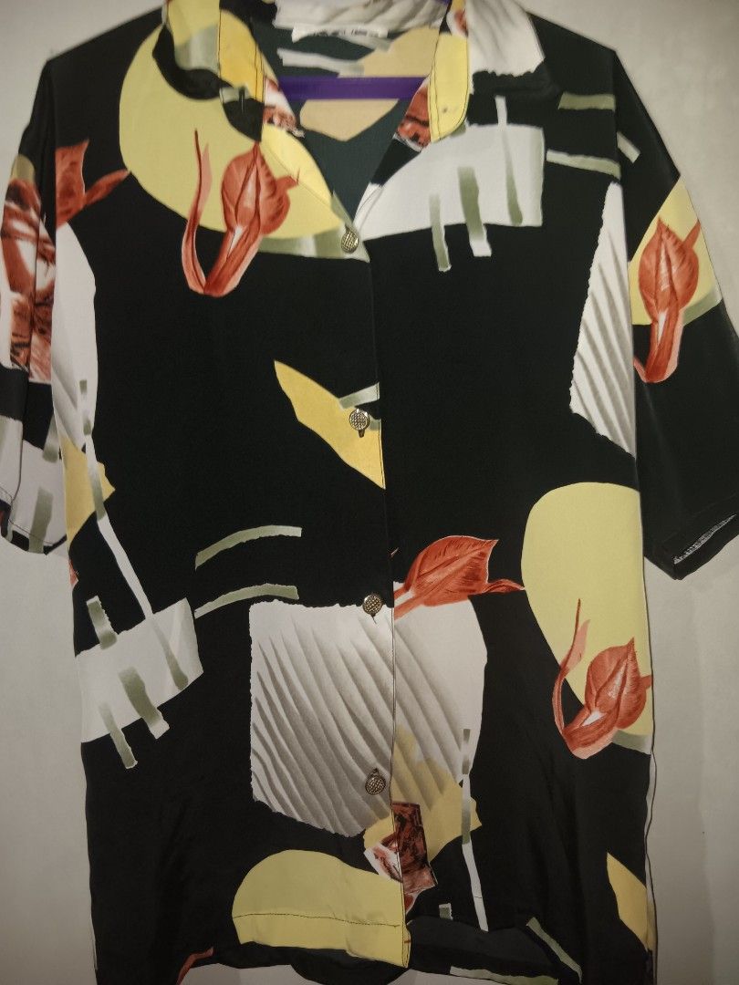 Vintage Black Abstract Pattern Short Sleeve Shirt (Category: Blouses) located in Manila. Submitted by gelo.is_selling (Listing ID 1470123382, Image 2). Description: - Style: Short-sleeve button-up with collar - Design: Bold abstract geometric and floral print in yellow, white, and rust orange - Fit: Relaxed fit - Fabric: Lightweight and breathable - Occasion: Ideal for summer and casual outings - Condition: Brand new / Excellent Measurement for r