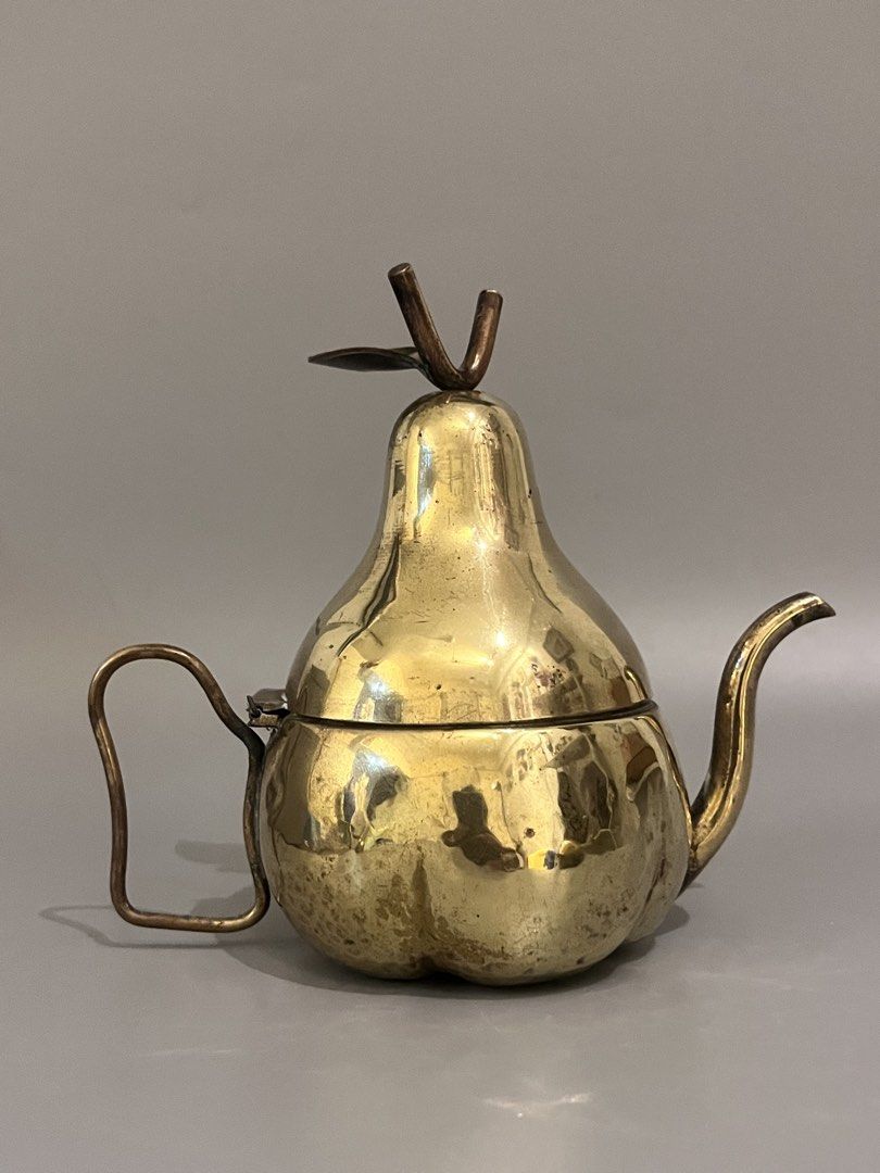 Vintage Brass Mini Pear Teapot (Category: Other Home Decor) located in Taguig. Submitted by frank63studio (Listing ID 1469988035, Image 1). Description: Vintage Brass Mini Pear Teapot 985php it can also be used as trinket box or display it as is unpolished 5.5" with tarnish and small dents.