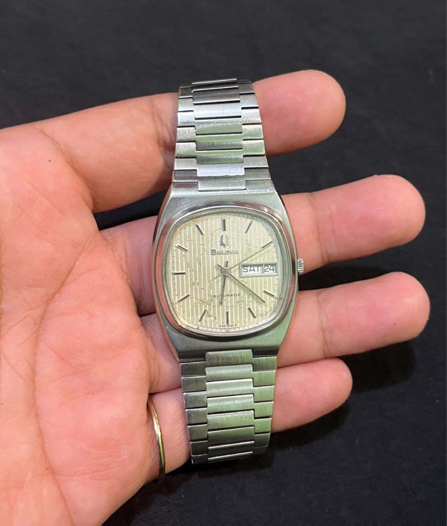 Vintage Bulova Automatic Day-Date Silver Tone Watch (Category: Men's Watches) located in Cebu City. Submitted by jbok_watches. (Listing ID 1470102835, Image 3). Description: - Vintage Bulova automatic watch - Silver-tone stainless steel case and bracelet - Textured silver dial with day and date at 3 o'clock - Signed Bulova clasp - Clean crystal and functional crown - Keeps accurate time; minor hairline scratches on case back from normal wear.