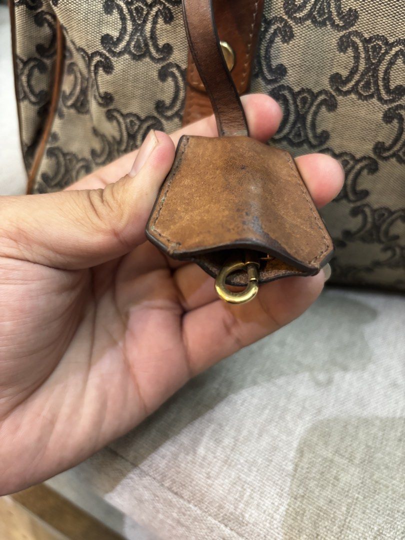 Vintage Celine Paris Canvas Boston Bag (Category: Luxury Bags & Wallets) located in Caloocan City. Submitted by neweagle-424b (Listing ID 1470058029, Image 2). Description: authentic legit Rank B condition scratch sign of used novaliches qc metro manila - Brand: Celine Boston Bag - Material: Brown monogram canvas with leather trim and handles - Interior: Red fabric lining with code S-ST-1019 stamped on the interior tag - Hardware: Gold-tone hardw