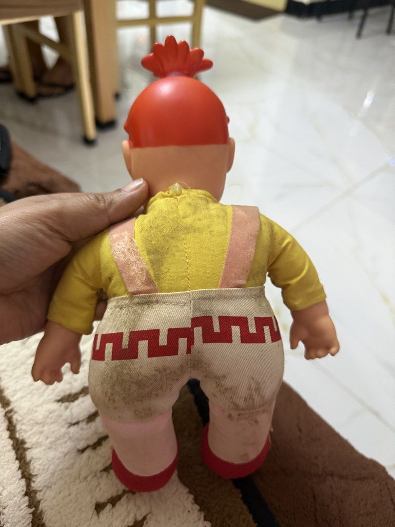 Vintage Chow King Goodles mascot plush doll (Category: Plushies & Soft Toys) located in Dasmarinas. Submitted by _adieeeee (Listing ID 1470029114, Image 2). Description: - Official Chowking Goodles promotional mascot doll - Design: Red plastic hair/head, yellow long-sleeve shirt with pink print, cream shorts with red hem, pink straps, and red shoes - Condition: Hard parts are fully intact - Note: Fabric shows minor dirt marks due to age and handl