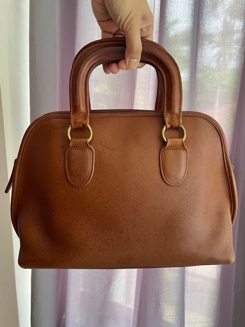 Vintage Coach Baxter in British Tan (9903) (Category: Luxury Bags & Wallets) located in Carigara. Submitted by shanshinemarie (Listing ID 1469988286, Image 2). Description: Brass Hardware Comes with hangtag With marks! Please zoom in on photos Charms not included Missing bag strap.