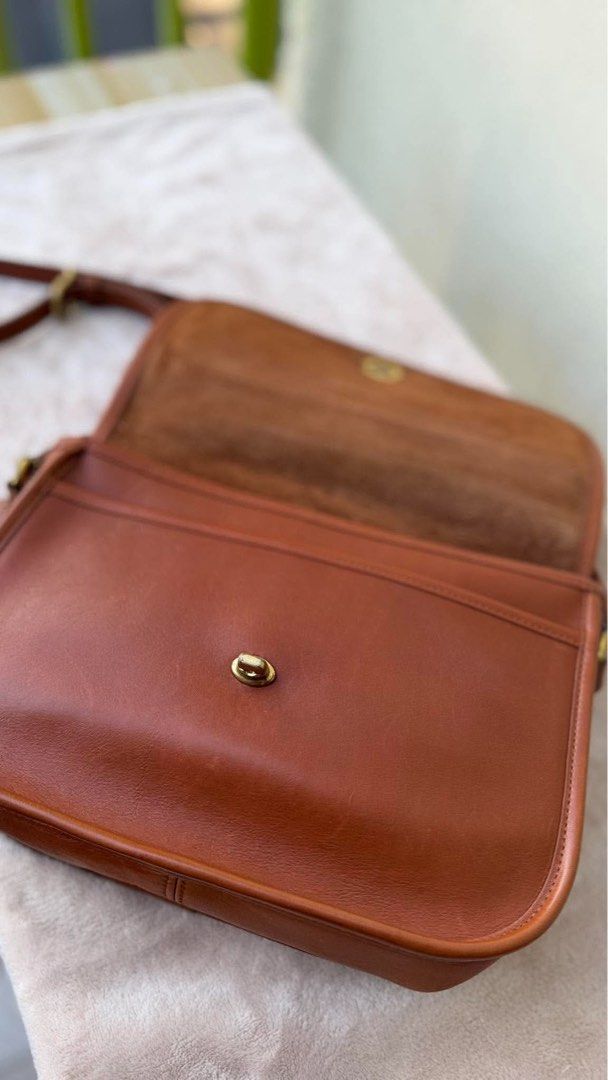 Vintage Coach City Style 9790 (Category: Cross-body Bags) located in San Jose. Submitted by kaia_collection (Listing ID 1470139178, Image 3). Description: Beautiful vintage bag, structurally intact and functional. Note: The bottom corner features a stiff, misshapen leather bulge. The leather here has hardened but is completely sturdy with no structural cracking or open tears. With original hangtag and strap .