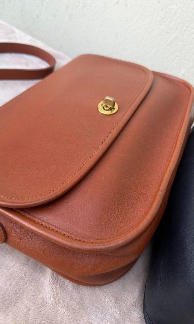 Vintage Coach City Style 9790 (Category: Cross-body Bags) located in San Jose. Submitted by kaia_collection (Listing ID 1470139178, Image 1). Description: Beautiful vintage bag, structurally intact and functional. Note: The bottom corner features a stiff, misshapen leather bulge. The leather here has hardened but is completely sturdy with no structural cracking or open tears. With original hangtag and strap .