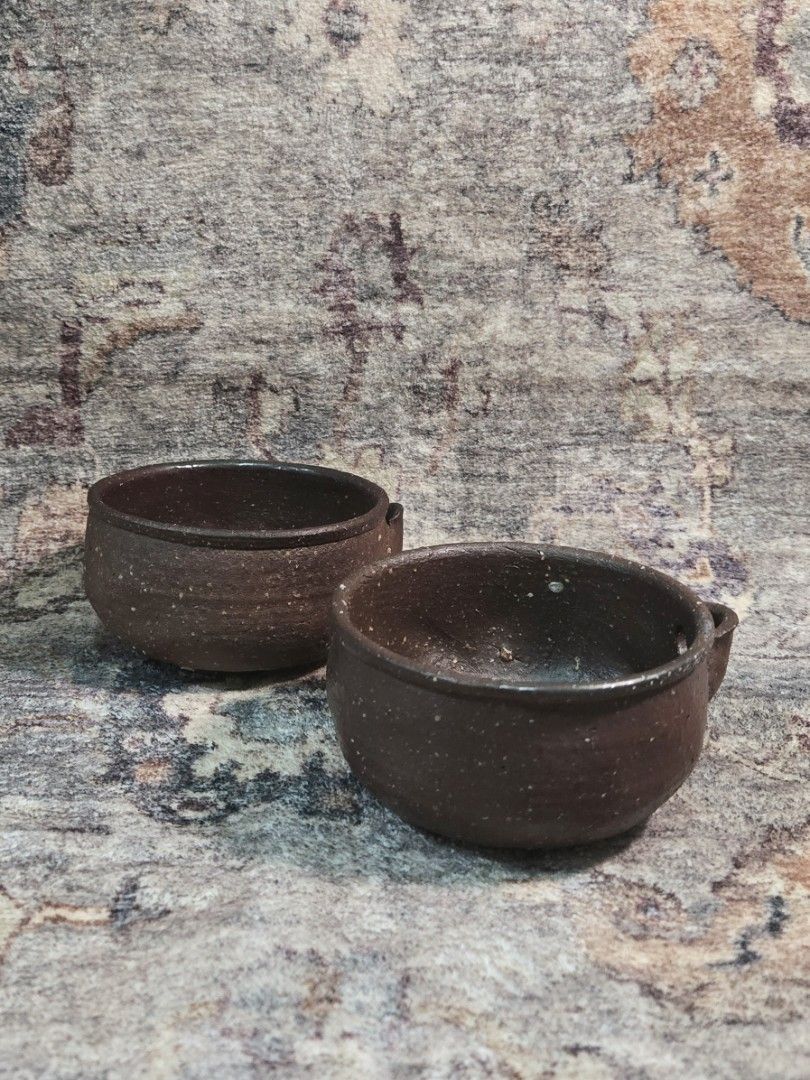 Vintage dark glazed studio chawan matcha bowl (per piece) (Category: Coffee & Tea Tableware) located in Manila. Submitted by cwknds (Listing ID 1470055411, Image 1). Description: sculpted from heavy iron-rich clay with a deep chocolate wash, side pour lip, and organic speckled texture. (chasen shown for scale comparison only) • vintage unused • ₱450/each ~ personally sourced&curated note: these are vintage pieces hence may show signs of age and w