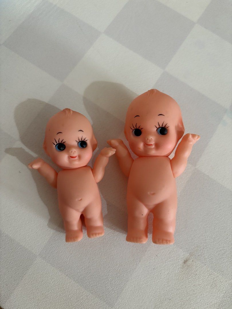 Vintage Kewpie Doll (Category: Figurines & Statues) located in Legazpi City. Submitted by loisfinds (Listing ID 1469964802, Image 1). Description: - Set of 2 vintage Kewpie dolls in different sizes - Made of peach-colored vinyl with standing pose - Features big black eyes, painted eyelashes, red lips, and molded hair - Clean surface with no major flaws or marks - Great retro display pieces for toy collectors - Rotatable head and arms - DM for mor