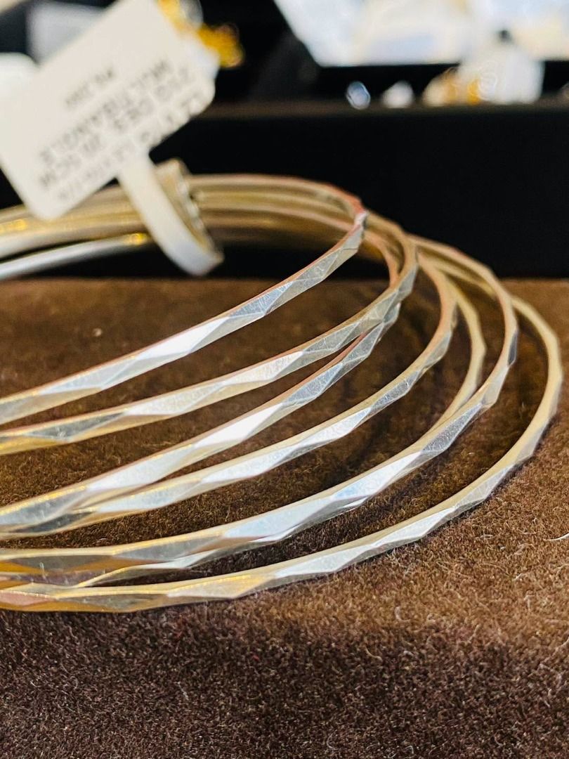 VINTAGE MULTI-BANGLE SILVER SET (Category: Bracelets) located in Baguio. Submitted by asna_taku (Listing ID 1470056642, Image 3). Description: 🤍✨ VINTAGE MULTI-BANGLE SILVER SET ✨🤍 A beautiful collection of timeless elegance and effortless sophistication! 💎 Featuring multiple sleek silver bangles adorned with intricate diamond-cut patterns that beautifully reflect the light, creating a subtle yet eye-catching sparkle. Their classic, minimalist