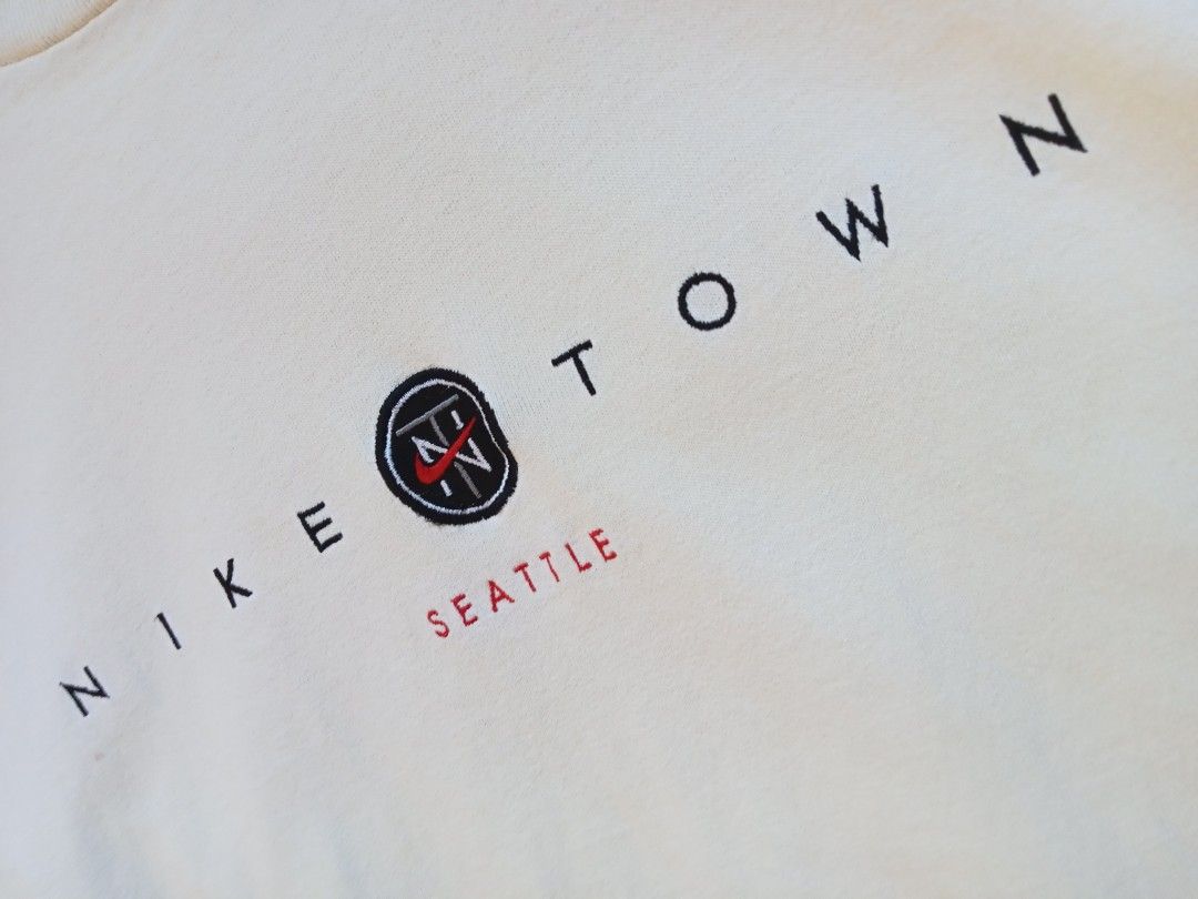 Vintage Nike Town Seattle roundneck tee (Category: Tshirts & Polo Shirts ) located in Bagabag. Submitted by thrift_stories96 (Listing ID 1470108515, Image 3). Description: Vintage Nike Town Seattle roundneck tee mens Small on tag fits medium crop boxy Length - 26.5 Width - 20.5 Condition - 8.5/10 Cream actual color Flaw - fade yellow stain sa right side laylayan..