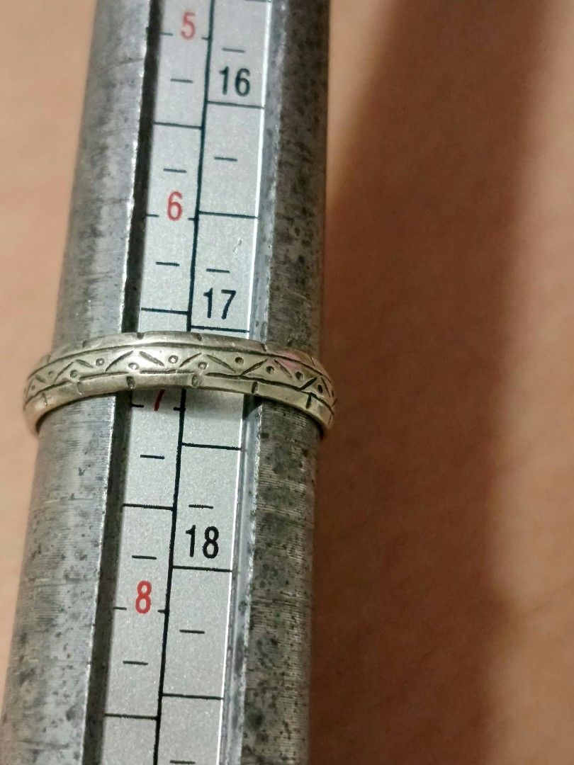 Vintage Patterned Silver Band Ring Size 17 (Category: Rings) located in Abucay. Submitted by thrifty.picked (Listing ID 1470121629, Image 1). Description: - Material & Design: Patterned silver 925 band with detailed geometric triangle and dot engraving all the way around - Size: Right around size 17 on the sizing mandrel - Fit & Feel: Slim profile and lightweight metal construction for comfortable everyday wear - Condition: Minor surface wear fro