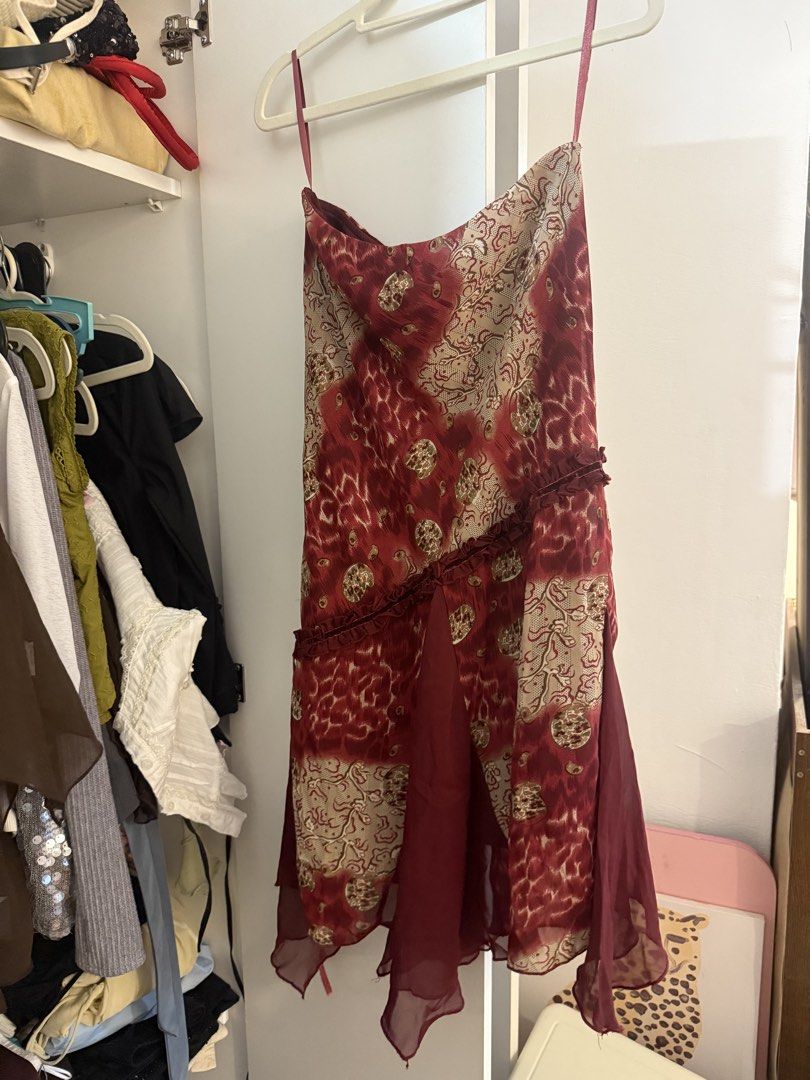 Vintage Red patterned skirt 26-28 (Category: Dresses) located in Quezon City. Submitted by wardrobetreasuresx (Listing ID 1470046361, Image 3). Description: - Deep red and cream abstract print midi dress - Features adjustable/included spaghetti straps - Unique diagonal front ruffle and asymmetrical chiffon hem - Lightweight, semi-sheer fabric - Perfect for parties, dinners, or casual outings - Easy to pair with heels or boots.