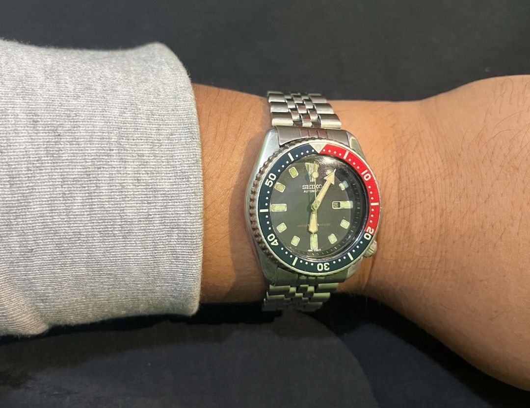 Vintage Seiko Automatic Pepsi Bezel Scuba Diver Watch (Category: Men's Watches) located in Cebu City. Submitted by jbok_watches. (Listing ID 1470101954, Image 2). Description: - Brand/Model: Classic Seiko Automatic Scuba Diver Watch - Dial & Bezel: Iconic red and blue Pepsi bezel with a classic black dial - Movement: Automatic movement, keeps good time - Case: Stainless steel case (approx. 38mm) with screw-down caseback and tsunami wave logo - Br