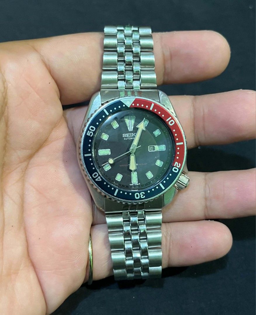Vintage Seiko Automatic Pepsi Bezel Scuba Diver Watch (Category: Men's Watches) located in Cebu City. Submitted by jbok_watches. (Listing ID 1470101954, Image 3). Description: - Brand/Model: Classic Seiko Automatic Scuba Diver Watch - Dial & Bezel: Iconic red and blue Pepsi bezel with a classic black dial - Movement: Automatic movement, keeps good time - Case: Stainless steel case (approx. 38mm) with screw-down caseback and tsunami wave logo - Br
