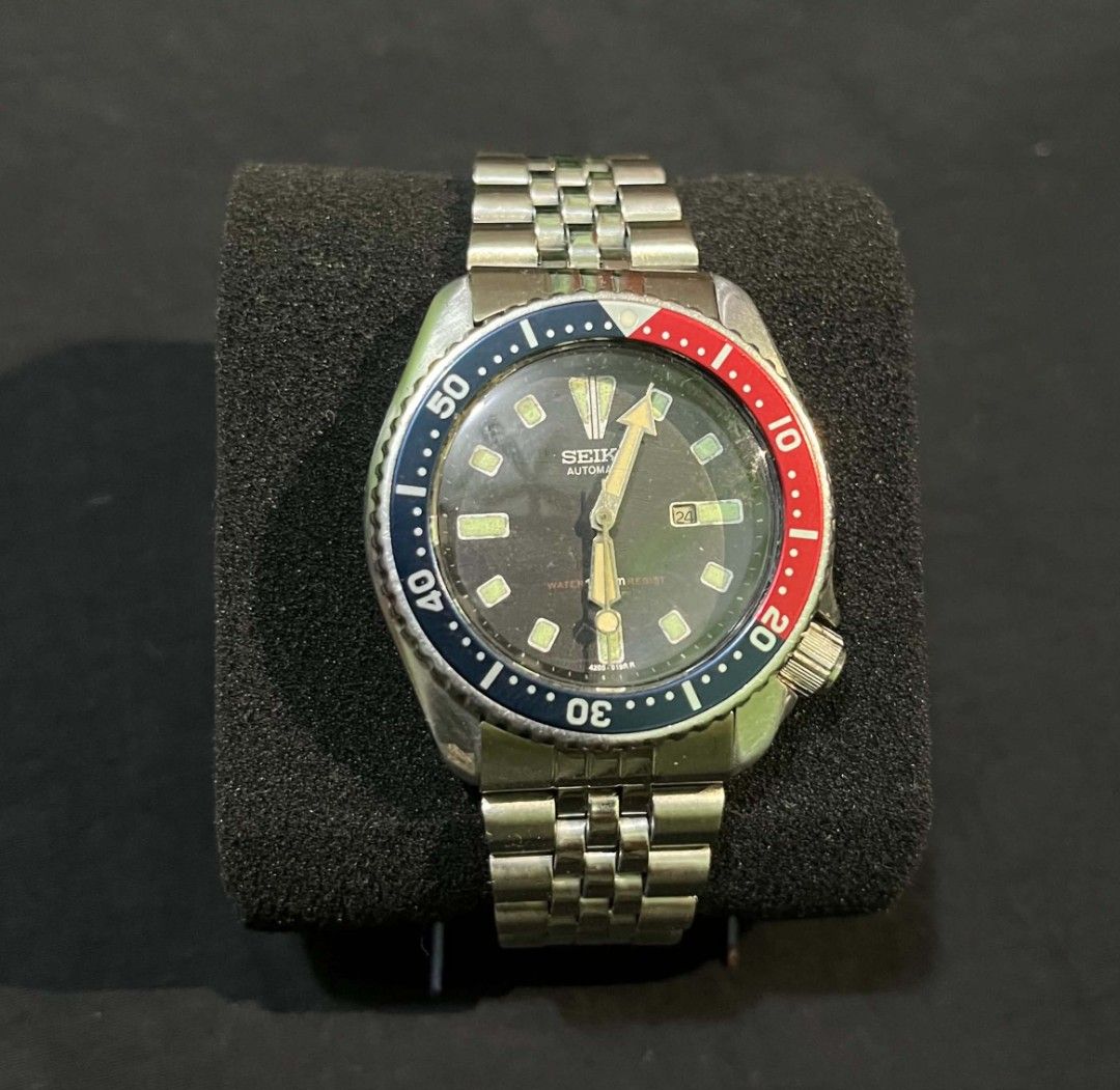 Vintage Seiko Automatic Pepsi Bezel Scuba Diver Watch (Category: Men's Watches) located in Cebu City. Submitted by jbok_watches. (Listing ID 1470101954, Image 1). Description: - Brand/Model: Classic Seiko Automatic Scuba Diver Watch - Dial & Bezel: Iconic red and blue Pepsi bezel with a classic black dial - Movement: Automatic movement, keeps good time - Case: Stainless steel case (approx. 38mm) with screw-down caseback and tsunami wave logo - Br