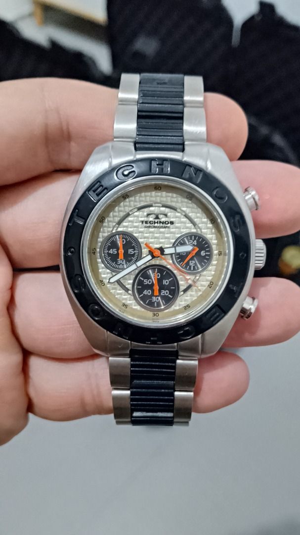 Vintage Technos Chronograph Watch Gold Dial (Category: Men's Watches) located in Malolos. Submitted by chrono_revival (Listing ID 1470049718, Image 1). Description: PLEASE READ THE FULL POST BEFORE SENDING ANY INQUIRIES. SERIOUS OFFERS ONLY PLEASE. ********** Authentic Technos TGM-525 - Gold “weave” dial with black sub-dials - Ceramic bezel and bracelet center links - Case size: approx. 42mm - Bracelet size: will fit up to approx. 16.5cm - Servic