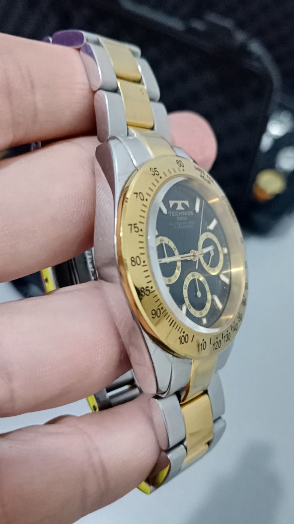 Vintage Technos Chronograph Watch Two-tone (Category: Men's Watches) located in Malolos. Submitted by chrono_revival (Listing ID 1470050176, Image 3). Description: PLEASE READ THE FULL POST BEFORE SENDING ANY INQUIRIES. SERIOUS OFFERS ONLY PLEASE. ********** Authentic Technos TGM-615 - Men’s Swiss Watch Diver’s Chronograph - Black dial with gold sub-dials - Non-rotating gold bezel - Screw-down crown - Original signature two-tone bracelet - Case s