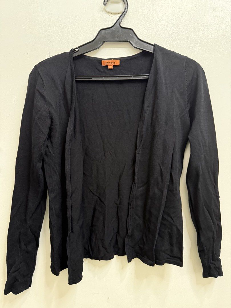 Vivi Black Cardigan Size M (Category: Coats, Jackets and Outerwear) located in Quezon City. Submitted by reivia.vend (Listing ID 1469998191, Image 1). Description: - Brand: Vivi - Style: Open-front knit cardigan - Color: Solid black - Size: M - Features: Lightweight fabric, long sleeves - Condition/Use: Great for daily wear and easy layering.
