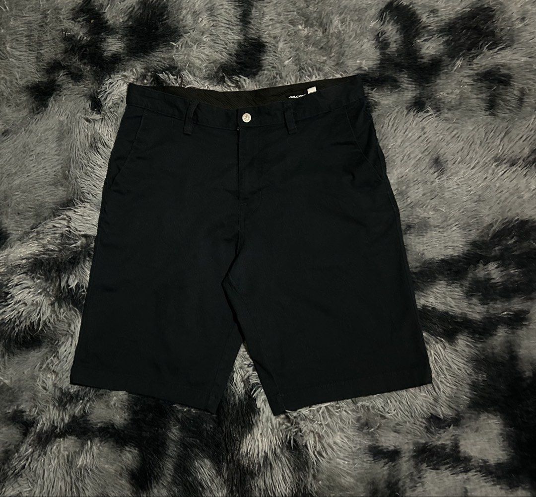 Volcom Navy Blue Shorts Size 34 W17 L22 (Category: Shorts) located in Cadiz. Submitted by jaybatiller (Listing ID 1470091874, Image 1). Description: - Brand: Volcom - Color: Navy Blue - Size: 34 - Condition: Clean, great overall condition - Features: Button closure, zip fly, back pockets - Details: Signature embroidered Volcom stone logo near the hem - Style: Versatile basic for casual everyday wear.