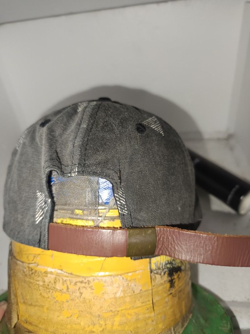 Volcom Cap Gray Brown Triangle Pattern (Category: Cap & Hats) located in Kuala Terengganu. Submitted by nazurah92 (Listing ID 1470023146, Image 2). Description: - Brand: Volcom - Style: Snapback cap with flat brim - Color/Design: Dark gray crown with white geometric triangle pattern and brown faux suede brim - Details: Round leather Volcom patch on front center, black adjustable strap with metal buckle - Material: 60% cotton, 40% polyester blend 