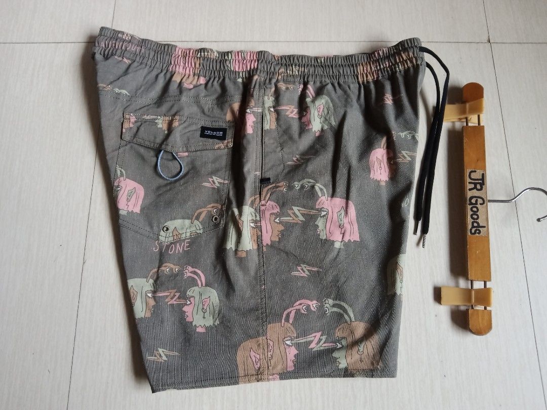Volcom Graphic Print Drawstring Shorts Olive Green (Category: Activewear) located in Tanay. Submitted by jrgoods (Listing ID 1469997150, Image 2). Description: Volcom Xxl to XL above the knee waistline 36-40 Length 18 Good as new condition 550+ship Tanay Rizal location Shipping Nationwide - Color: Olive green with quirky psychic head and lightning bolt graphics - Waistband: Elastic with adjustable black drawstring cords - Pockets & Details: Back 