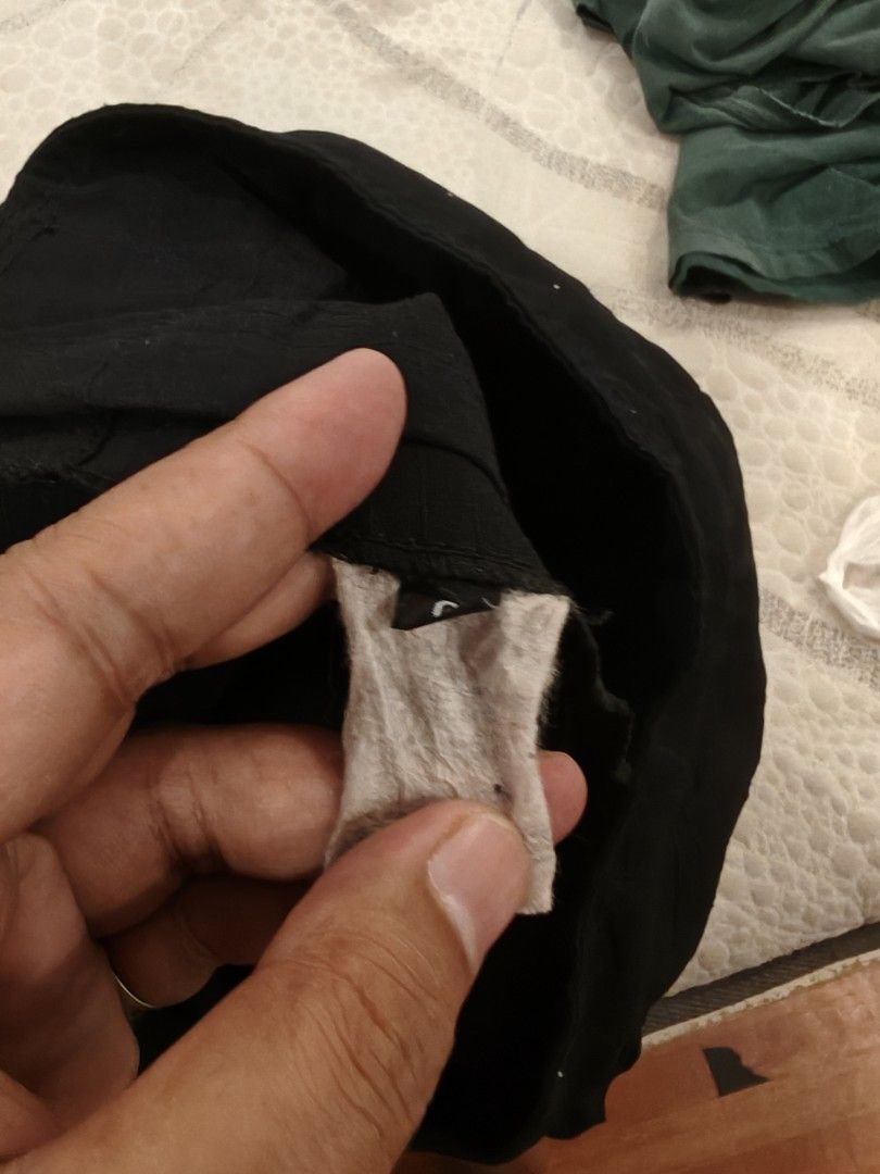 Vouuk Fight Shorts Black (Category: Shorts) located in Manila. Submitted by thriftnmeal (Listing ID 1470017265, Image 3). Description: - Brand: Vouuk - Color: Black with white logo text and geometric wolf graphic - Fit & Closure: Velcro waist closure with a drawstring channel - Mobility: Side slits for enhanced movement during training - Condition: Good overall, with a small tear on the fabric near the hem - Sizing: Tag indicates size.