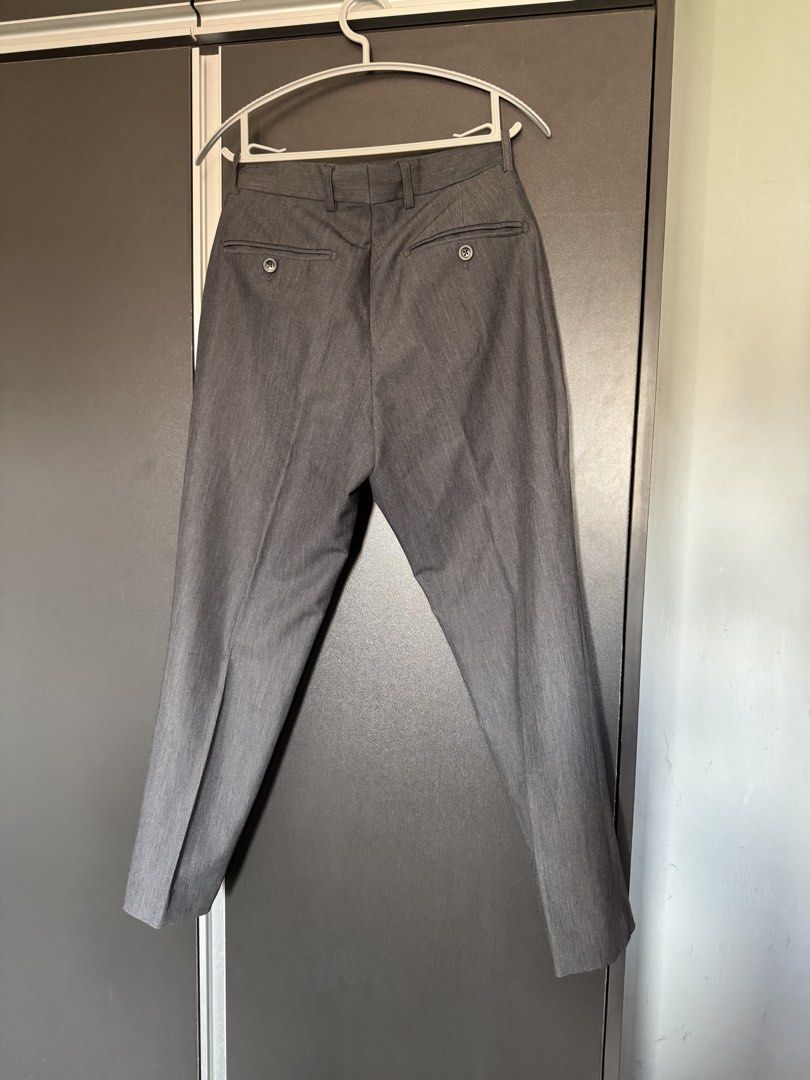 Wallstreet Fitted Grey Formal Pants (Category: Trousers) located in Dasmarinas. Submitted by akelvin23 (Listing ID 1470110403, Image 2). Description: - Brand: Wallstreet - Color: Grey - Fit: Fitted cut with button closure and zipper fly - Details: Two back welt pockets with buttons, dark lining inside waistband - Best for: Office wear or smart casual events RFS: decluttering Wallstreet gray slacks trousers Waist - 29 in Length - 34.5 in Leg hole 