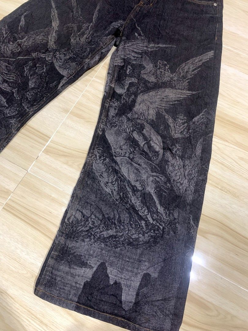 Wanna lab AOP pants (Category: Jeans) located in Manila. Submitted by thegoodstuffs__ (Listing ID 1470138877, Image 3). Description: - Color & Wash: Dark grey wash denim - Design: All-over Renaissance style angel and figure graphic print - Fit: Trendy wide leg fit - Details: Classic five-pocket styling, button fly, and belt loops - Material: Heavyweight, durable fabric - Style: Unique streetwear statement piece Size: 32width 41Length.
