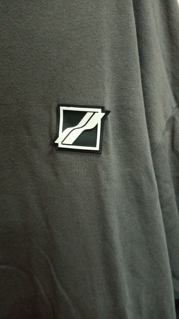 WE11DONE Grey Oversized T-Shirt Size S (Category: Tshirts & Polo Shirts ) located in Manila. Submitted by rizu09 (Listing ID 1470040242, Image 3). Description: - Brand: WE11DONE - Color: Grey - Size: S (Oversized fit) - Material: 100% Cotton (Made in Korea) - Design: Small square logo patch on chest with a large, colorful graphic print across the back - Style: Streetwear, relaxed fit.
