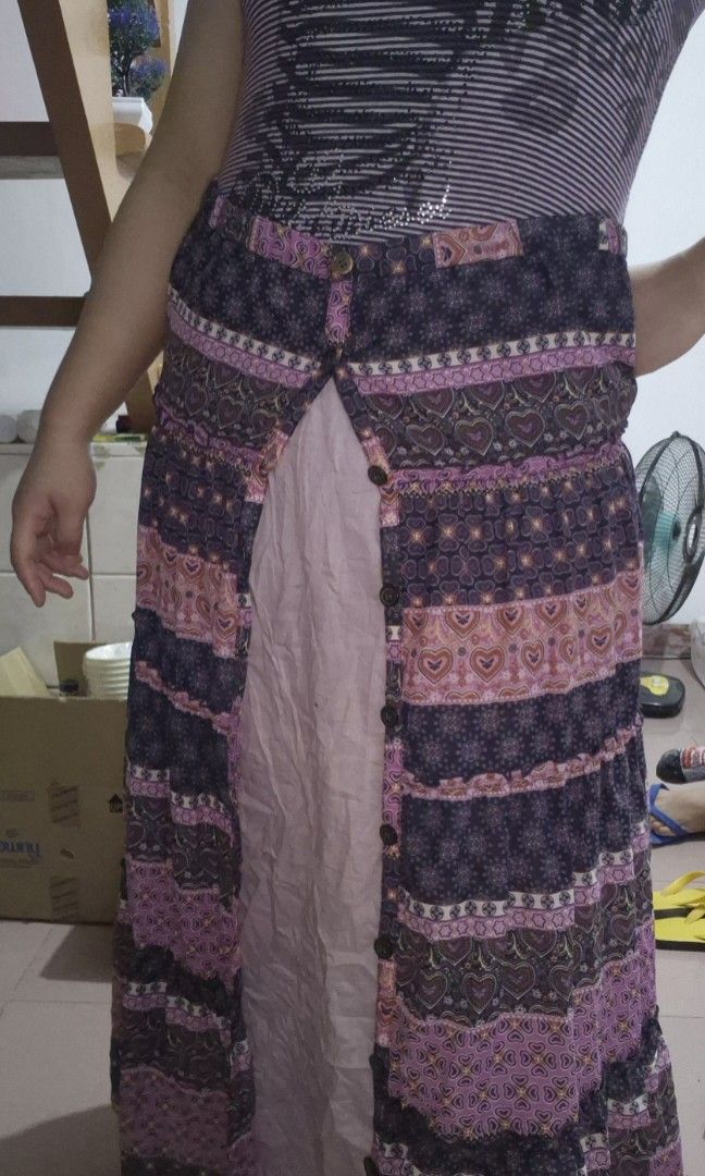Whimsy Purple Boho Hearts Tiered Ruffle Buttoned Maxi Skirt (Category: Skirts) located in Calamba. Submitted by bb.lace (Listing ID 1469973831, Image 2). Description: -functional buttons, can be worn fully buttoned or open and with inner lining -printed design with tiered mini ruffles -twirly when worn.