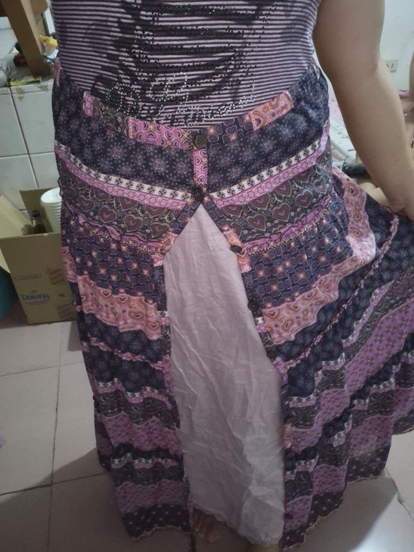 Whimsy Purple Boho Hearts Tiered Ruffle Buttoned Maxi Skirt (Category: Skirts) located in Calamba. Submitted by bb.lace (Listing ID 1469973831, Image 3). Description: -functional buttons, can be worn fully buttoned or open and with inner lining -printed design with tiered mini ruffles -twirly when worn.