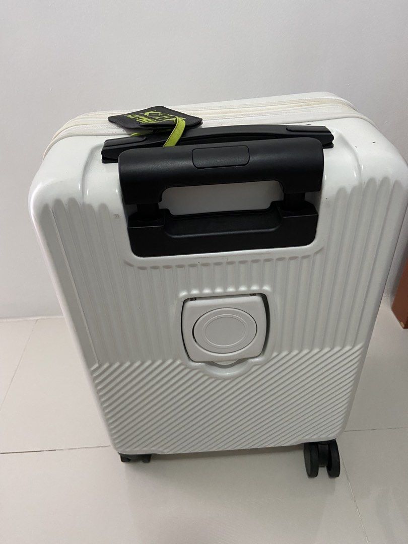 White 4-Wheel Luggage with Foldable Cup Holder (Category: Luggage) located in Manila. Submitted by SySyShop (Listing ID 1469968934, Image 2). Description: - Color/Design: White hardside with stylish ribbed and diagonal texture patterns - Convenience: Built-in retractable cup holder on the back - Mobility: Smooth-rolling spinner wheels and a push-button telescopic black handle - Extras: Includes a black luggage tag with striking bright green lette