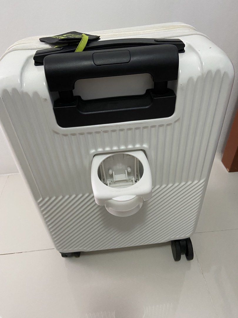 White 4-Wheel Luggage with Foldable Cup Holder (Category: Luggage) located in Manila. Submitted by SySyShop (Listing ID 1469968934, Image 3). Description: - Color/Design: White hardside with stylish ribbed and diagonal texture patterns - Convenience: Built-in retractable cup holder on the back - Mobility: Smooth-rolling spinner wheels and a push-button telescopic black handle - Extras: Includes a black luggage tag with striking bright green lette