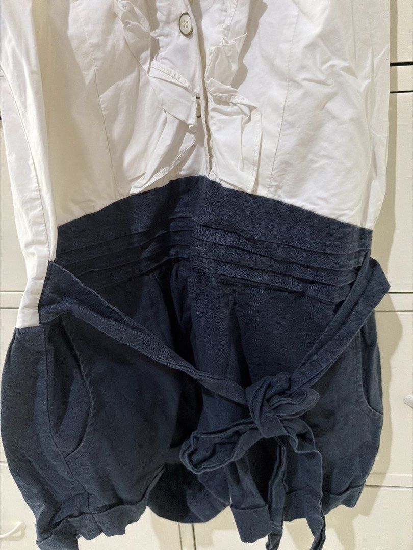 White and Navy Blue Ruffle Halter Romper (Category: Rompers) located in Rizal. Submitted by kyliemaine (Listing ID 1470023469, Image 3). Description: - Two-tone design: white sleeveless halter top and dark blue shorts - Halter neck with back button closure and charming front ruffle trim - Trendy open back design - Shorts feature a matching tie belt at the waist and cuffed hems - Side zipper for easy changing - Ideal for warm weather days or casua