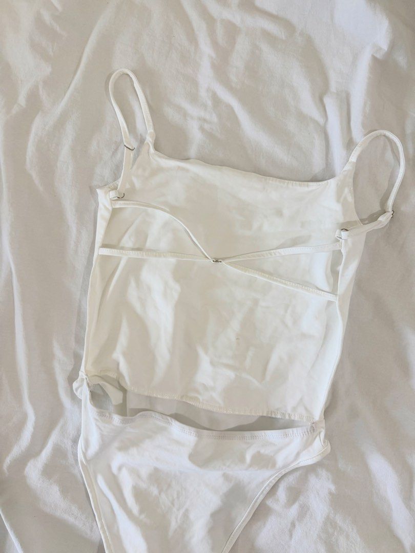 white backless crisscross bodysuit (Category: Sleeveless) located in Manila. Submitted by nicswhuut (Listing ID 1470118308, Image 2). Description: 📌can do lalamove (manila area only!) 📌j&t for outside manila 📌mop: gcash, maya, or metrobank 📌loc: sampaloc, manila 📌lp are posted UNLESS u r getting 2 or more items then i can give discount 🤗.