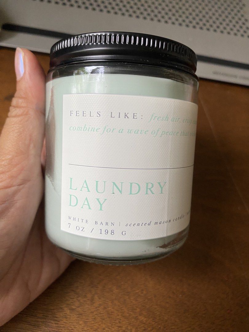 White Barn Laundry Day Scented Mason Candle 7 oz (Category: Home Fragrance) located in Santa Rosa. Submitted by hoardqueensdeclutter (Listing ID 1470134135, Image 1). Description: - Brand: White Barn (Bath & Body Works) - Scent: Laundry Day (Fresh air, crisp eucalyptus, and soft lavender with natural essential oils) - Size: 7 oz / 198 g - Condition: Brand new, unused with intact safety warning label and barcode - Packaging: Classic mason jar with