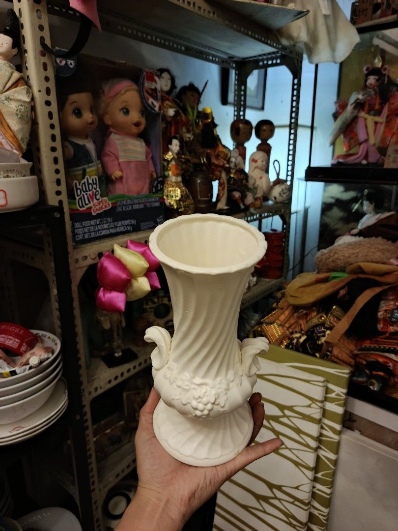White Ceramic Ribbed Vase And Planter Set (Category: Vases & Decorative Bowls) located in Quezon City. Submitted by valerieluarez (Listing ID 1470132436, Image 3). Description: - Set of 2 white ceramic decor pieces with a glossy finish - 1 round ribbed planter bowl with a bottom drainage hole - 1 tall decorative vase featuring grape/vine details and scroll handles - Excellent clean condition, free of chips and cracks.