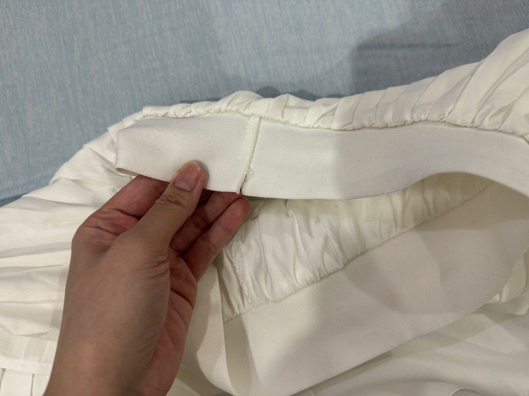 White Double-Layer Pleated Skort (Category: Skirts) located in Manila. Submitted by buymiclothes.47 (Listing ID 1470092691, Image 3). Description: Cream Double-Layer Pleated Skort | ₱100 Cute cream/off-white pleated mini skort with a double-layer design and built-in shorts! * Very stretchable — fits up to 30waist * Color: Cream / Off-white * Waist: Approx. 11.5–12 inches (laid flat) * Elastic waistband * Built-in shorts underneath * Condition: Pr