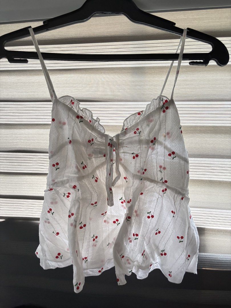 white drawstring tank top with cherries (Category: Sleeveless) located in Manila. Submitted by iyahpreloved_ (Listing ID 1469965753, Image 2). Description: size M!.