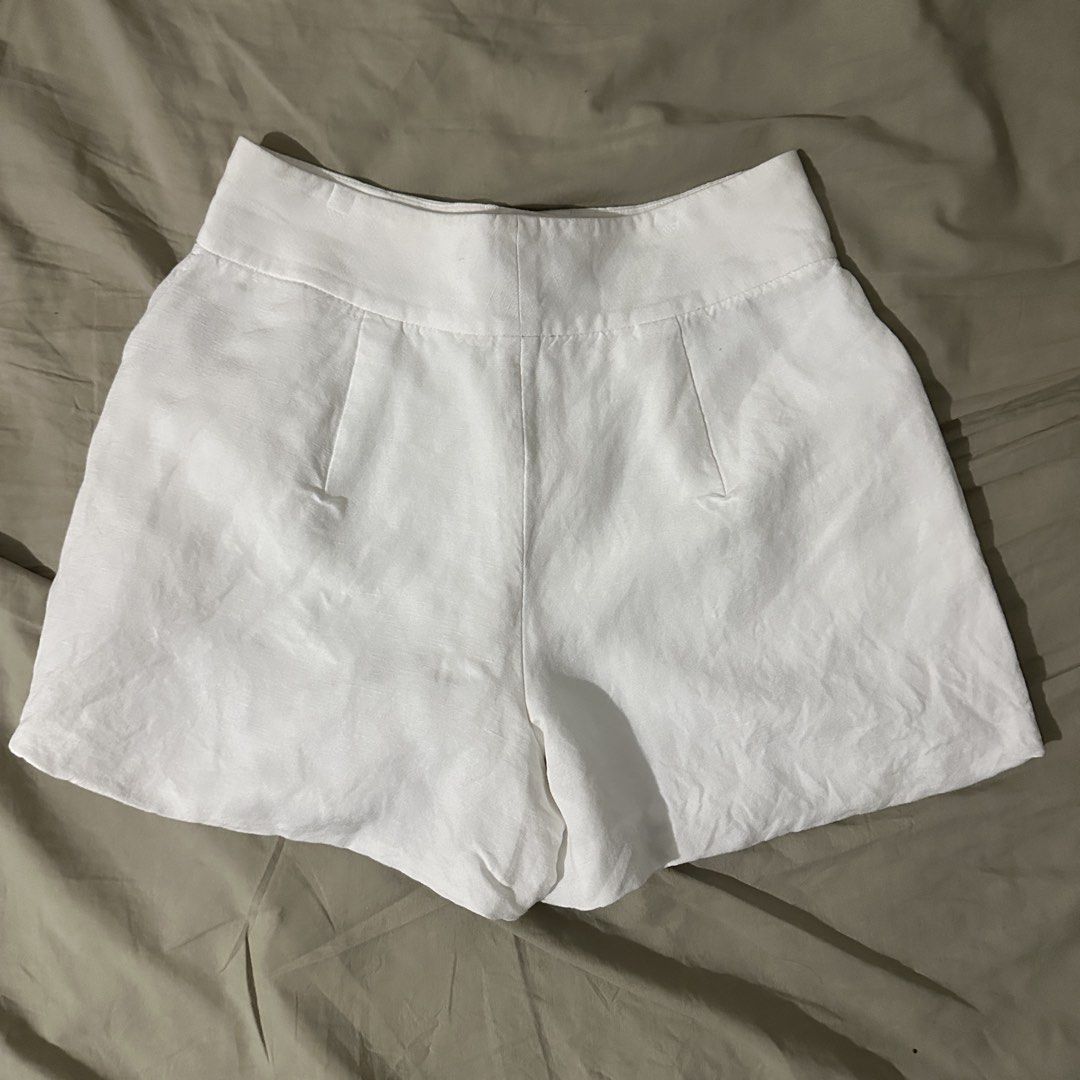 White Linen Blend Shorts (Category: Shorts) located in Manila. Submitted by mjoycie (Listing ID 1470102104, Image 2). Description: - Size: Waist - 26, Length - 13 - Material: 55% linen, 45% viscose (100% polyester lining) - Details: Structured waistband, functional front pockets, back darts - Style: Clean, minimalist warm-weather staple.
