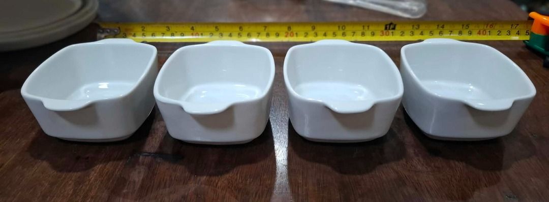 White Mini Serving Dishes Set of 4 (Category: Dinnerware & Cutlery) located in Pasig City. Submitted by dripcounty (Listing ID 1470026072, Image 1). Description: White Mini Serving Dishes Set of 4 ₱250 Bought in the Philippines Condition: Good / preloved Four white rectangular mini serving dishes with small side tabs. Price is for all four pieces shown. Actual item shown in photos. Delivery fee shouldered by buyer (Lalamove / other courier). Item