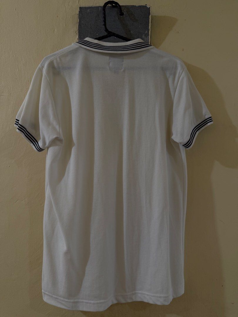 White Polo Shirt with Striped Collar (Category: Tshirts & Polo Shirts ) located in Las Pinas. Submitted by rareriroruru (Listing ID 1470054120, Image 2). Description: - Color: White with black and white striped details on cuffs and collar - Size: Small - Length: 26 in - Width: 18 in - Fit: Classic fit with button placket - Fabric: Breathable and comfortable - Style: Versatile staple for casual days or smart-casual outings - Condition: Excellent.