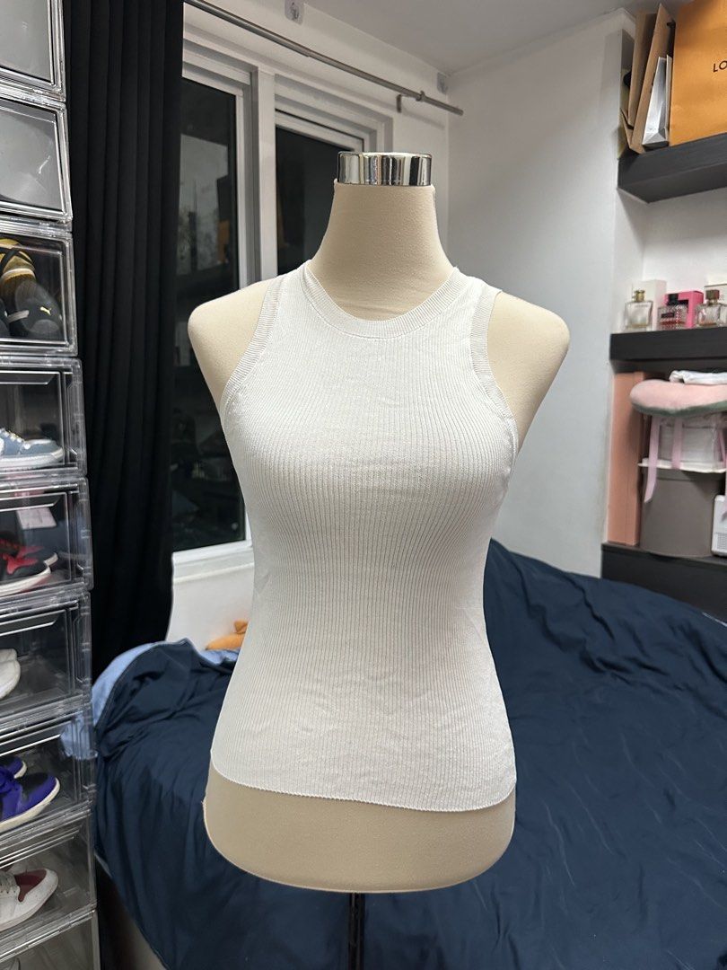 White Ribbed Knit Tank Top Sleeveless (Category: Sleeveless) located in Quezon City. Submitted by valeriorac74670 (Listing ID 1470045501, Image 2). Description: - Color: White - Material: Stretchy ribbed knit - Fit: Fitted silhouette with a classic round neckline - Style: Super versatile for layering or wearing solo.