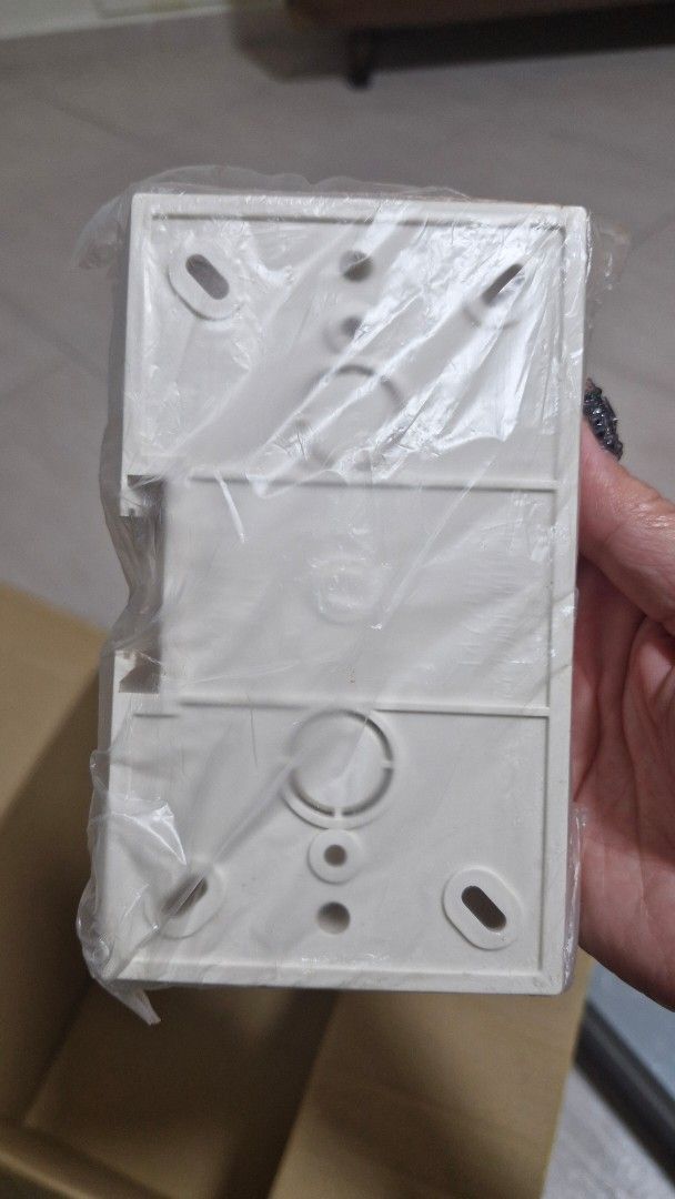 White surface mounting electrical switch socket box casing (Category: Electrical, Adaptors & Sockets) located in Singapore. Submitted by minimalist2000 (Listing ID 1470098593, Image 1). Description: - Brand new white plastic surface mounting box - Suitable for electrical switches and sockets - Still sealed in original clear plastic packaging - Size: 147x86x33 - Qty: 7pcs.
