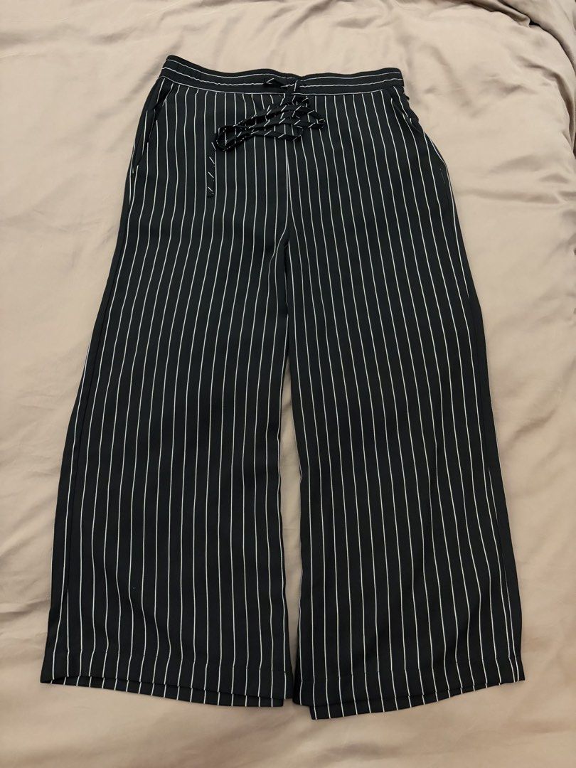 Wide Leg Pants (Category: Jeans) located in Pasig City. Submitted by gdeclutterwithme (Listing ID 1470120335, Image 1). Description: - Brand: Stradivarius - Size: XS - Color: Black with white pinstripes - Fit: Wide leg - Waist: Adjustable drawstring with side zipper closure - Origin: Made in Cambodia - Condition: Clean fabric, excellent staple for casual or smart casual outfits (and formal!) dm for more deets ! .